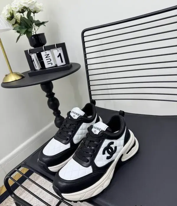 Chanel Black & White Quilted Sneakers With Iconic Interlocking CC Logo On The Side