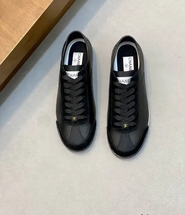 Chanel Black Calfskin & Suede Trim Sneakers With Gold Tone Interlocking CC Logo