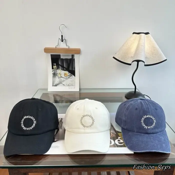 Matin Kim Circular Repeating Logo Embroidered Washed Canvas Baseball Cap in Multiple Colors
